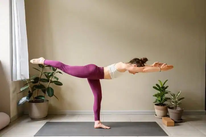 Woman doing Yoga exercise Oxted to help with toning the body. 