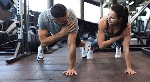 Sculpting Sleek Arms: The Essential Role of Cardio in Toning Without Bulking Up 1 Image of man and woman doing Cardio Oxted to tone their arms.